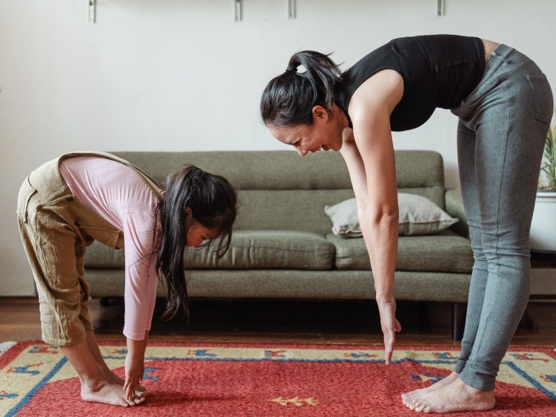 two people exercising at home