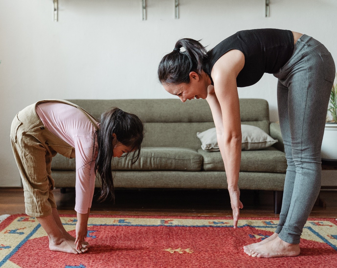 two people exercising at home